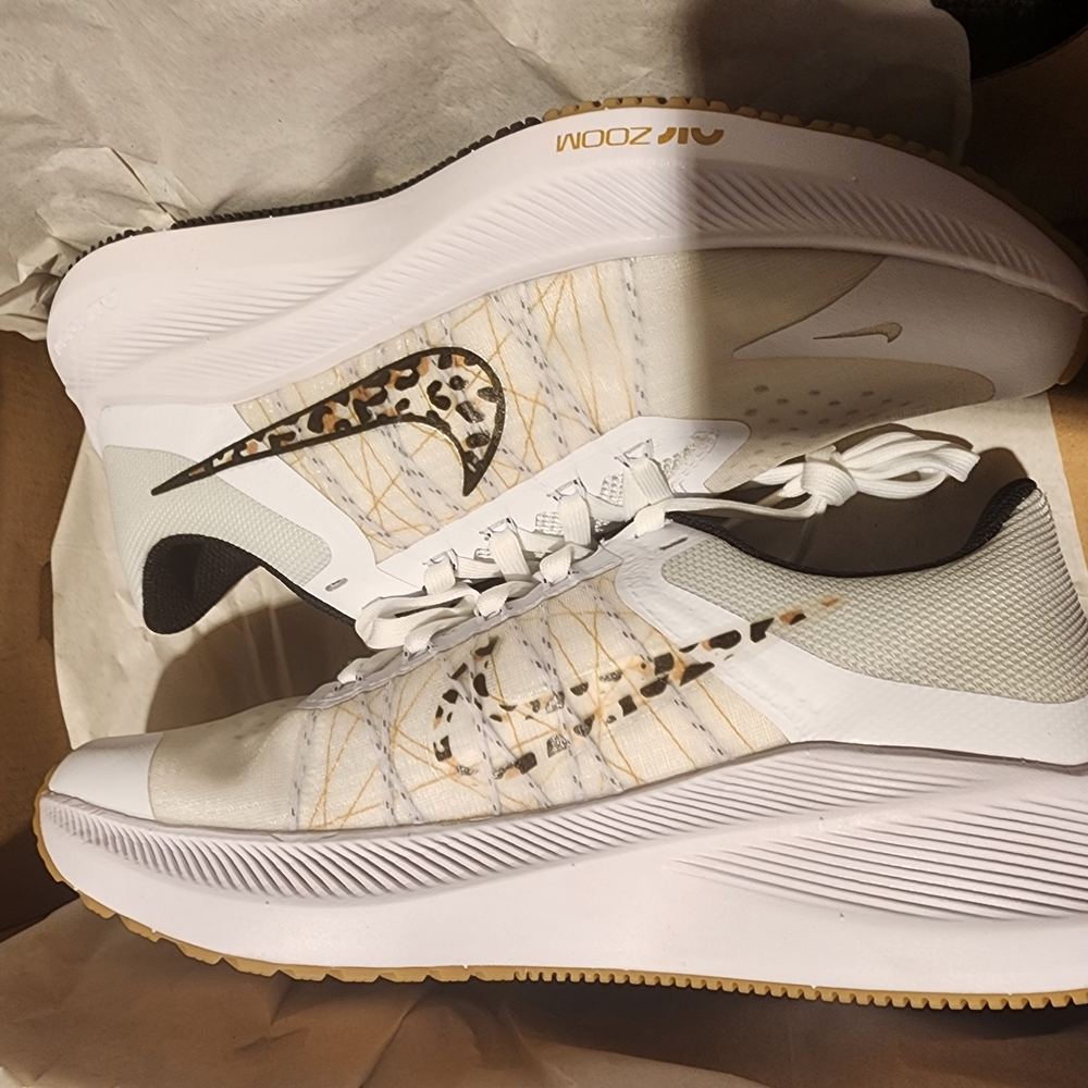 Nike White and Gold Athletic Shoes with Cushioned Sole